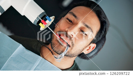 Above, medical x ray and patient in dentist office for checkup or mouth operation. Dental hygiene, healthcare or oral assessment with man at clinic for appointment, dentistry procedure or surgery 126209722