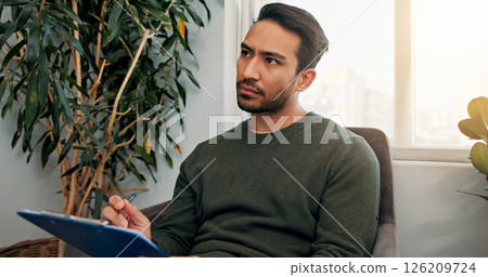 Waiting room, thinking and man with clipboard for writing information, insurance form and medical history. Healthcare, hospital and person with checklist for wellness, appointment and consultation Waiting room, thinking and man with clipboard for writing information, insurance form and medical history. Healthcare, hospital and person with checklist for wellness, appointment and consultation 126209724