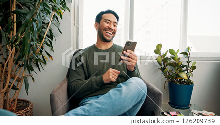 Smile, waiting room and man with smartphone, appointment and joke with social media. Happy person, funny meme or mobile user with cellphone, laughing and online humor with app or message to contact 126209739