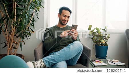 Happy, waiting room and man with cellphone, typing and connection with social media. Person, communication and texting with smartphone, internet and online reading with network and message to contact Happy, waiting room and man with cellphone, typing and connection with social media. Person, communication and texting with smartphone, internet and online reading with network and message to contact 126209741