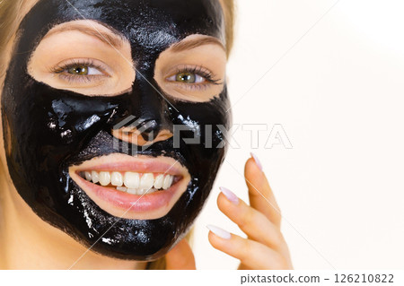 Woman with black peel off mask on face 126210822