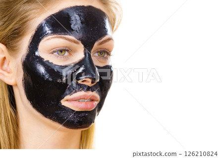 Girl black carbo peel off mask on face 126210824