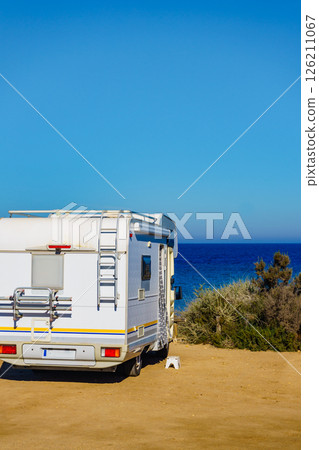 Camper car on beach, camping on seashore 126211067