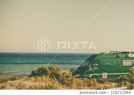 Camper van on beach, camping on seashore Camper van on beach, camping on seashore 126211068