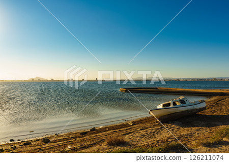 Old boat on sea shore, Spain 126211074