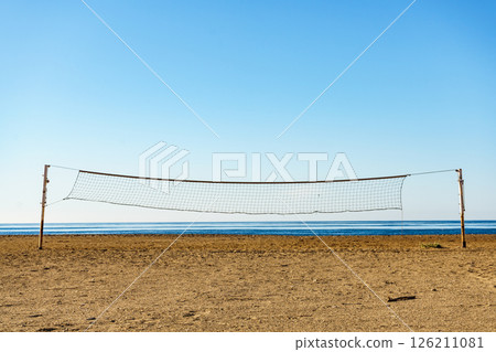 Volleyball net on sandy beach. 126211081