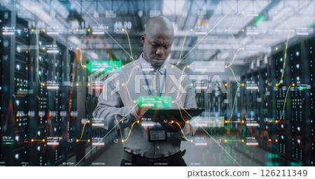 Futuristic Big Data Center: Administrator Using Digital Tablet. Animated Diagrams of Internet Traffic Futuristic Big Data Center: Administrator Using Digital Tablet. Animated Diagrams of Internet Traffic 126211349