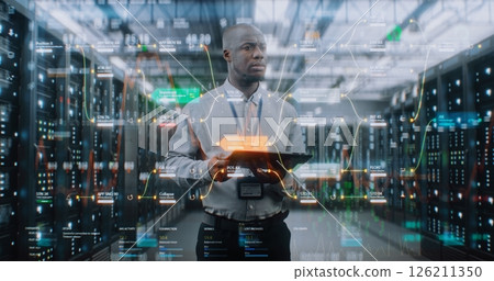 Futuristic Big Data Center: Administrator Using Digital Tablet. Animated Diagrams of Internet Traffic 126211350