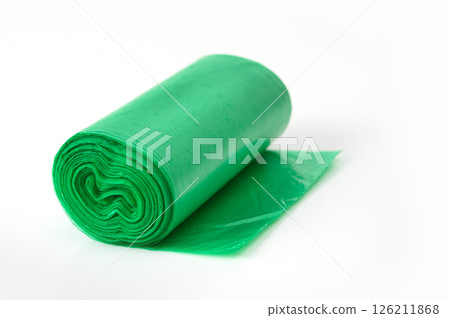 Green plastic garbage bag roll unrolled on white background, household waste bag for cleaning or trash disposal. Green plastic garbage bag roll unrolled on white background, household waste bag for cleaning or trash disposal. 126211868