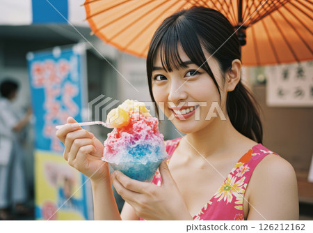 A smiling girl happily eating shaved ice at a summer festival (AI-generated image) A smiling girl happily eating shaved ice at a summer festival (AI-generated image) 126212162