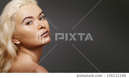 Sexy blond woman in retro style. Beautiful woman model in femininity pose with fashion make-up, soft skin, hairstyle 126212198