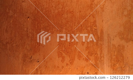 Worn and Damaged Orange Wall 126212279