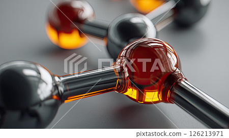 Molecular structure with shiny black and orange spheres connected by rods, representing scientific or chemical concept 126213971