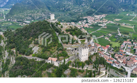 Ruins of ancient castles rise majestically above verdant vineyards in northern Italy Ruins of ancient castles rise majestically above verdant vineyards in northern Italy 126215187