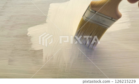 Painting a fresh canvas with gentle brush strokes during a serene afternoon in a sunlit studio Generative AI 126215229