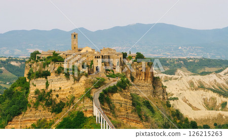Exploring the ancient charm of a cliffside village perched on rocky elevations in Italy at dusk Generative AI Exploring the ancient charm of a cliffside village perched on rocky elevations in Italy at dusk Generative AI 126215263