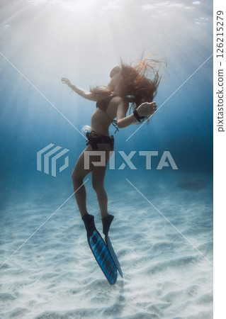 Gorgeous beauty freediver woman underwater. Freediving with beautiful woman in blue sea. Gorgeous beauty freediver woman underwater. Freediving with beautiful woman in blue sea. 126215279