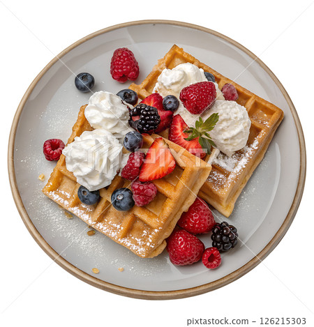 Delicious golden waffles topped with fresh mixed berries and whipped cream, sweet breakfast 126215303