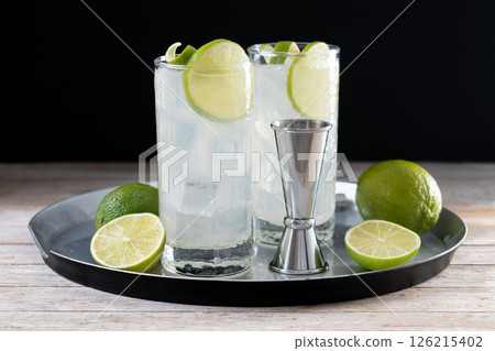 Gin Fizz cocktail with lime on black background 126215402