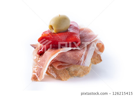 Spanish pincho with serrano ham, pepper and olive isolated on white background 126215415