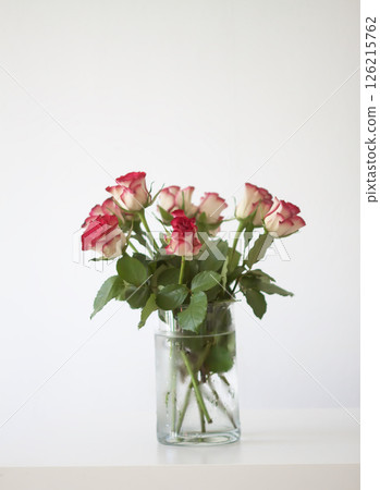 Red rose flowers. Romantic bouquet in minimalist style interior. Red rose flowers. Romantic bouquet in minimalist style interior. 126215762