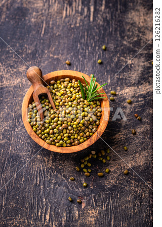 Raw uncooked mung beans on black background Raw uncooked mung beans on black background 126216282