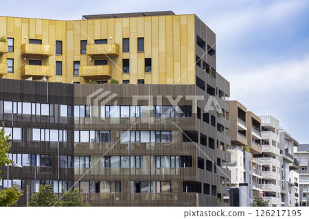 Modern architecture buildings with gold and wood cladding in Montpellier, France Modern architecture buildings with gold and wood cladding in Montpellier, France 126217195