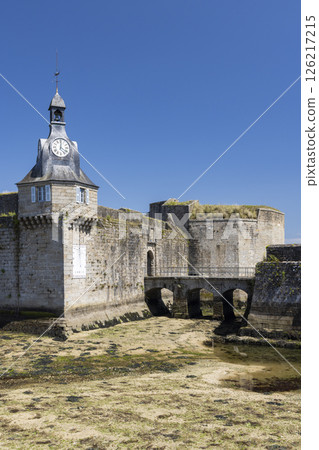 Concarneau walled city, ramparts with clock tower and drawbridge at low tide in Brittany, France 126217215