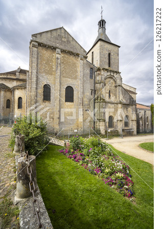 Saint Hilaire le Grand Church rising over colorful flowerbed in Poitiers, France 126217222