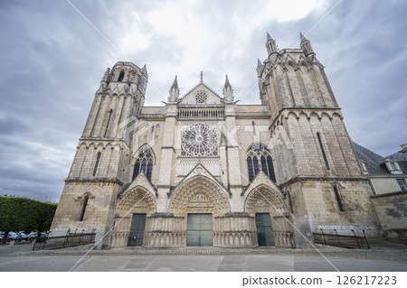 Poitiers Cathedral imposing facade rising under cloudy sky in France Poitiers Cathedral imposing facade rising under cloudy sky in France 126217223