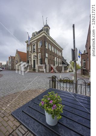 Pink flowers decorating a table in front of the town hall of Nieuwpoort, Netherlands 126217271
