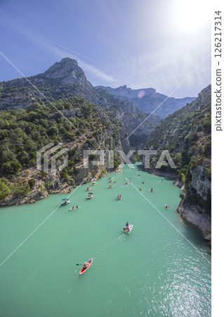 Tourists kayaking and boating in the Verdon Gorge, enjoying turquoise water and sunny weather Tourists kayaking and boating in the Verdon Gorge, enjoying turquoise water and sunny weather 126217314