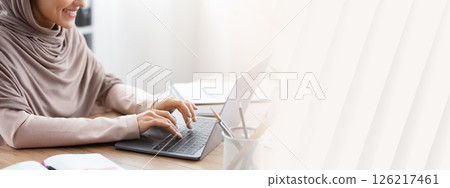 Smiling Arabic Woman Working On Laptop For New Project At Workplace In Office, Cropped Image With Copy Space. 126217461