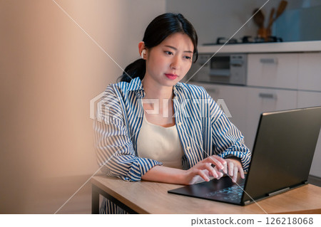 Young business people having a remote meeting late at night Young business people having a remote meeting late at night 126218068
