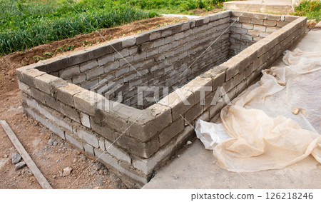 The process of building a home pool for storing water 126218246