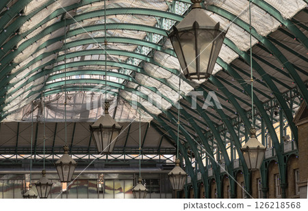 Architecture greco-roman style with iron glass roof and Lanterns hanging on the ceiling in Covent Garden. 126218568