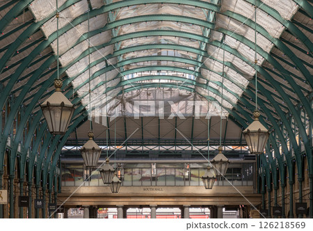 Architecture greco-roman style with iron glass roof and Lanterns hanging on the ceiling in Covent Garden. 126218569