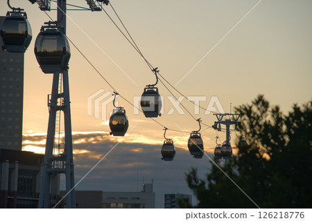 Sunset city and aerial gondola 126218776