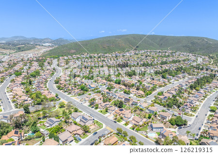 Aerial view of San Marcos neighborhood, with houses and street. South California 126219315