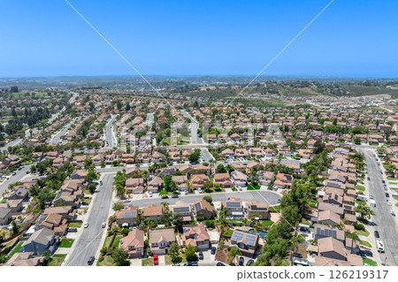 Aerial view of San Marcos neighborhood, with houses and street. South California 126219317