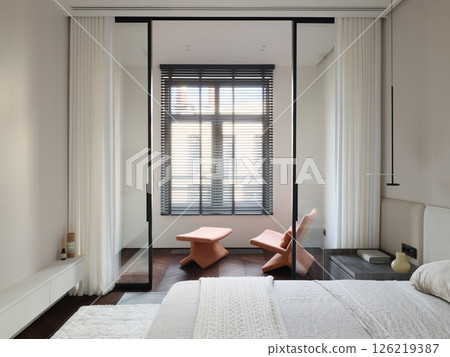 A Modern Bedroom Featuring a Glass Partition and Exceptionally Stylish Furniture Elements A Modern Bedroom Featuring a Glass Partition and Exceptionally Stylish Furniture Elements 126219387