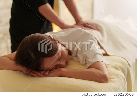 Relaxation staff and senior female customer 126220506