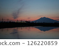 A train running at dusk and Mt. Iwaki 126220859
