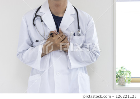 Image of a doctor clutching his chest in pain (Japanese, male, no face, 30s) Image of a doctor clutching his chest in pain (Japanese, male, no face, 30s) 126221125
