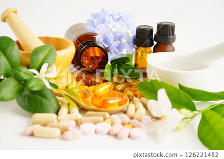 Alternative medicine herbal organic capsule with vitamin E omega 3 fish oil, mineral, drug with herbs leaf natural supplements for healthy good life. 126221452