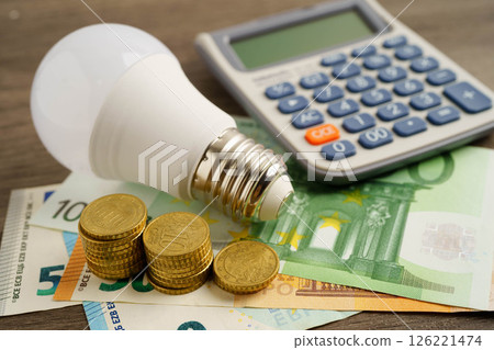 Cost of electric utilities with light bulb for payment. Cost of electric utilities with light bulb for payment. 126221474