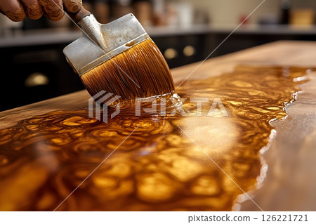 Crafting beauty, Applying finish to a wooden surface with a brush stroke 126221721