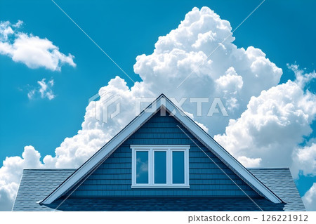 Architectural harmony, house roof meets the vast expanse of blue sky Architectural harmony, house roof meets the vast expanse of blue sky 126221912