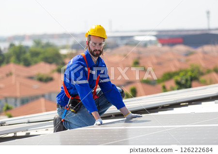 Man worker set installation and inspection standards of solar panels on roof of an industrial factory. Team technician inspection solar cell. Alternative innovation power environmental Man worker set installation and inspection standards of solar panels on roof of an industrial factory. Team technician inspection solar cell. Alternative innovation power environmental 126222684