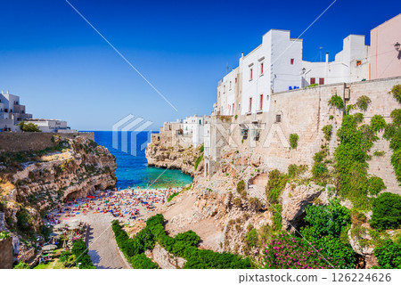 Polignano a Mare, Italy. Summer beach of Cala Paura in Puglia, one of most beautiful at Adriatic Sea 126224626